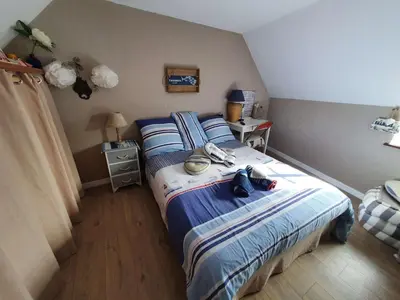 Un ou plusieurs lits dans un hébergement de l'établissement Penty bigouden 18ème classé 2** jardin en ville