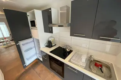 Cuisine ou kitchenette dans l'établissement Spacieux n°8 en centre historique
