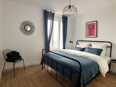 Un ou plusieurs lits dans un hébergement de l'établissement Superbe appartement rénové et tout confort à Brest