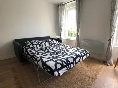 Un ou plusieurs lits dans un hébergement de l'établissement Superbe appartement rénové et tout confort à Brest