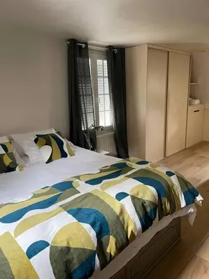 Un ou plusieurs lits dans un hébergement de l'établissement Villa chic à Plouigneau avec piscine privée
