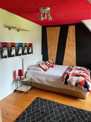 Un ou plusieurs lits dans un hébergement de l'établissement Villa chic à Plouigneau avec piscine privée
