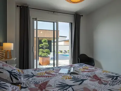 Un ou plusieurs lits dans un hébergement de l'établissement Holiday Home Villa Ty Coz by Interhome