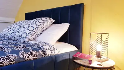 Un ou plusieurs lits dans un hébergement de l'établissement KerElo Le Ptit St Roch, maisonnette cosy, mer 5km, Ploudalmezeau