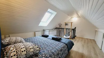 Un ou plusieurs lits dans un hébergement de l'établissement KerElo Le Ptit St Roch, maisonnette cosy, mer 5km, Ploudalmezeau