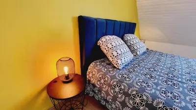 Un ou plusieurs lits dans un hébergement de l'établissement KerElo Le Ptit St Roch, maisonnette cosy, mer 5km, Ploudalmezeau