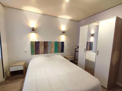 Un ou plusieurs lits dans un hébergement de l'établissement Appartement au centre de TREBEURDEN et à 500m de la plage - Ref 665