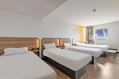 Un ou plusieurs lits dans un hébergement de l'établissement B&B HOTEL Brest Centre Port de Commerce