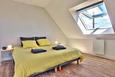 Un ou plusieurs lits dans un hébergement de l'établissement Le 5 Bel Air à Plogoff.