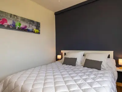 Un ou plusieurs lits dans un hébergement de l'établissement Holiday Home Le Bruit de la Mer - Trouz ar Mor by Interhome