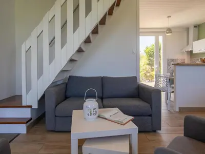 Coin salon dans l'établissement Holiday Home Le Bruit de la Mer - Trouz ar Mor by Interhome