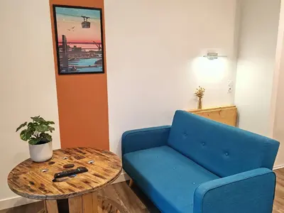 Coin salon dans l'établissement Les studios propres et tout équipés