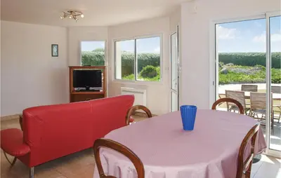 Télévision ou salle de divertissement dans l'établissement Holiday Home La Digue