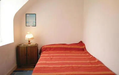 Un ou plusieurs lits dans un hébergement de l'établissement Holiday Home Kermathéano