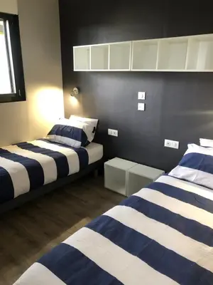 Un ou plusieurs lits dans un hébergement de l'établissement Maison chaleureuse et cosy en bois de 2021 Près de Quimper