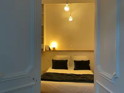 Un ou plusieurs lits dans un hébergement de l'établissement les croix appartements