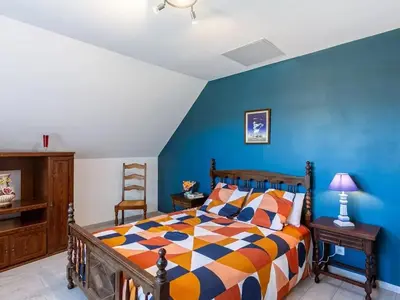 Un ou plusieurs lits dans un hébergement de l'établissement Maison cosy à Plouescat avec jardin et terrasse