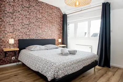 Un ou plusieurs lits dans un hébergement de l'établissement Appartement neuf style industriel *** proche de la mer