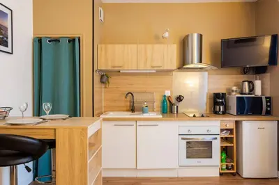 Cuisine ou kitchenette dans l'établissement Cocon douillet