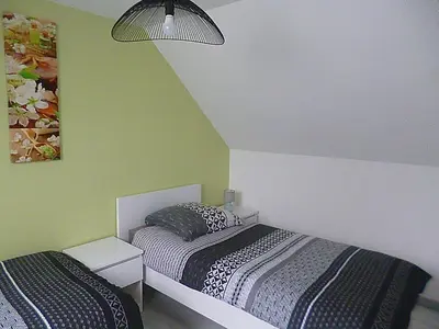Un ou plusieurs lits dans un hébergement de l'établissement gite au calme centre finistère jardin clos