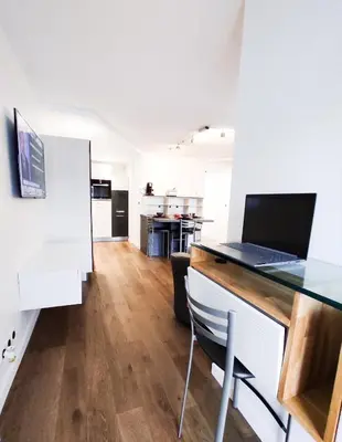 Cuisine ou kitchenette dans l'établissement T3 au centre ville avec balcon, parking gratuit