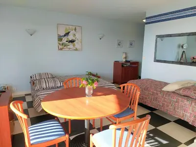 Coin salon dans l'établissement Apartment in Cornouaille near Sandy Beach