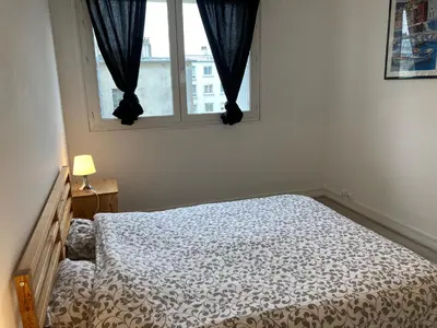 Un ou plusieurs lits dans un hébergement de l'établissement Appartement spacieux hyper centre Secteur Liberté