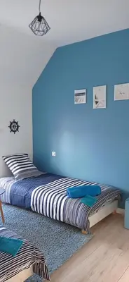 Un ou plusieurs lits dans un hébergement de l'établissement L'Escale Bretonne 6 personnes, proche mer et centre ville, jardin privé et clos