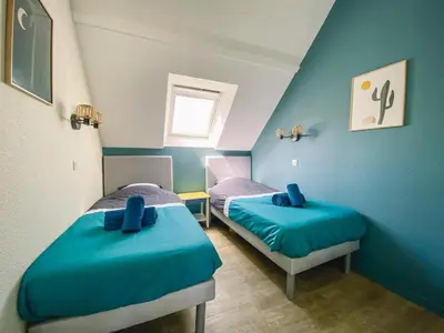 Un ou plusieurs lits dans un hébergement de l'établissement Appartement en duplex front de mer, Cap Coz