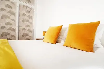 Un ou plusieurs lits dans un hébergement de l'établissement Chez Jeannette, appartement entre centre et plages