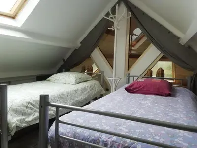 Un ou plusieurs lits dans un hébergement de l'établissement La maison au bord de l'eau