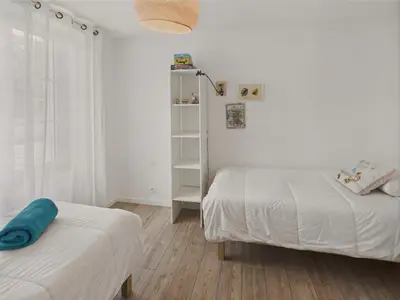 Un ou plusieurs lits dans un hébergement de l'établissement Vacances en famille a 250m de la mer a Penmarch