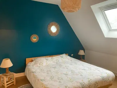 Un ou plusieurs lits dans un hébergement de l'établissement Chambre d'hôtes de Kermoal-cuisine & salle de bain privées