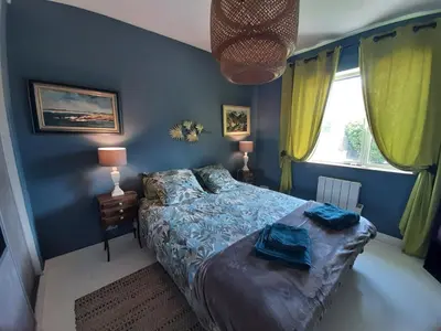 Un ou plusieurs lits dans un hébergement de l'établissement Maison Chaleureuse Bord de Mer