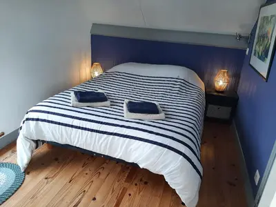 Un ou plusieurs lits dans un hébergement de l'établissement Maison Chaleureuse Bord de Mer