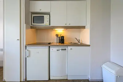 Cuisine ou kitchenette dans l'établissement Le Galet