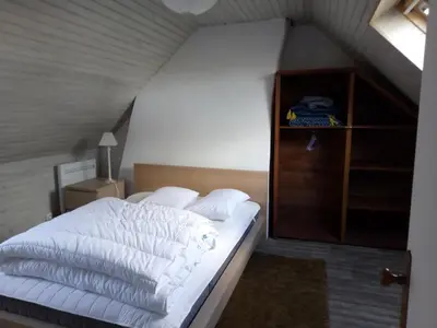 Un ou plusieurs lits dans un hébergement de l'établissement Petite maison dans les Monts d'Arrée TY COZ