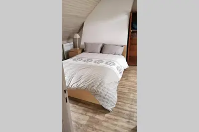 Un ou plusieurs lits dans un hébergement de l'établissement Petite maison dans les Monts d'Arrée TY COZ