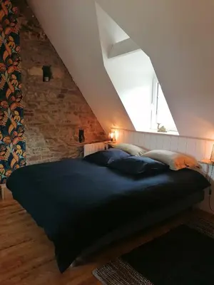 Un ou plusieurs lits dans un hébergement de l'établissement Moulin de brezal et étang à 20 minute de la mer