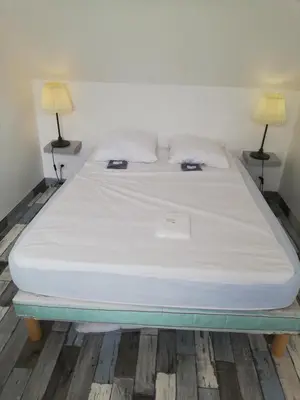 Un ou plusieurs lits dans un hébergement de l'établissement Maison bord de mer