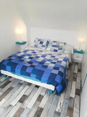 Un ou plusieurs lits dans un hébergement de l'établissement Maison bord de mer