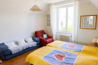 Un ou plusieurs lits dans un hébergement de l'établissement Au coeur de Tréffiagat - maison pour 6 - 300m de la plage