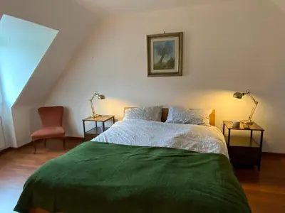 Un ou plusieurs lits dans un hébergement de l'établissement Magnifique Maison face à l'Océan - Pointe du RAZ