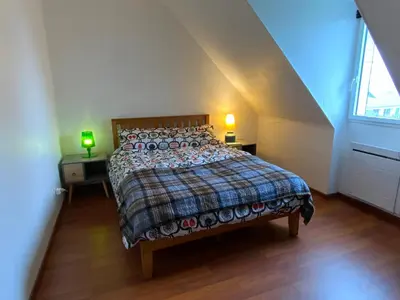 Un ou plusieurs lits dans un hébergement de l'établissement Magnifique Maison face à l'Océan - Pointe du RAZ