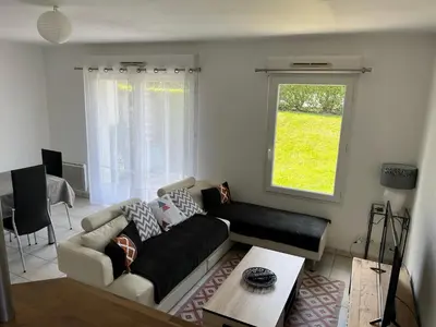 Coin salon dans l'établissement Appartement + Jardin