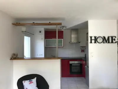 Cuisine ou kitchenette dans l'établissement Appartement + Jardin