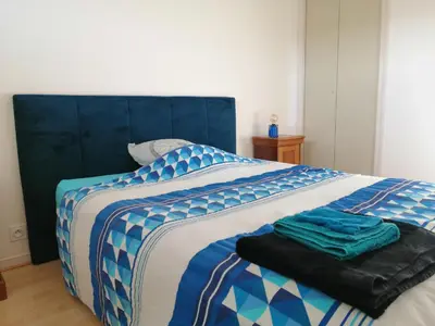 Un ou plusieurs lits dans un hébergement de l'établissement Appartement T3 vue sur rivière, 2 chambres 65M2