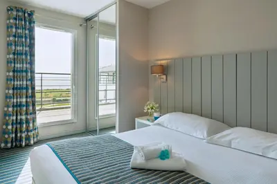 Un ou plusieurs lits dans un hébergement de l'établissement Residence Thalasso Concarneau