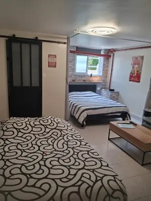 Un ou plusieurs lits dans un hébergement de l'établissement Appartement au calme proche d'un petit bois dans quimper