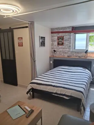 Un ou plusieurs lits dans un hébergement de l'établissement Appartement au calme proche d'un petit bois dans quimper